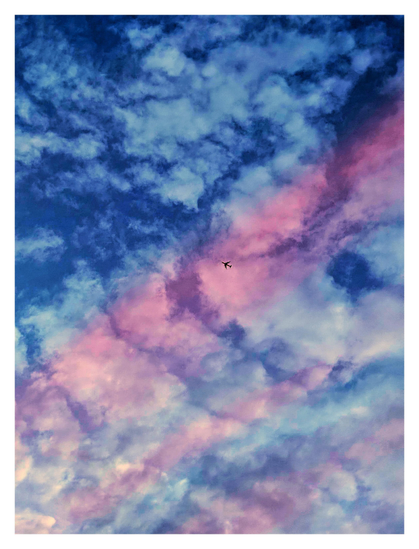 A high-contrast photo of white clouds against a deep blue sky. Three bands of red light cross the image diagonally from lower left to upper right, with the topmost and widest band crossing the middle. In the center of this band is the crisp, dark silhouette of a tiny, distant airplane.