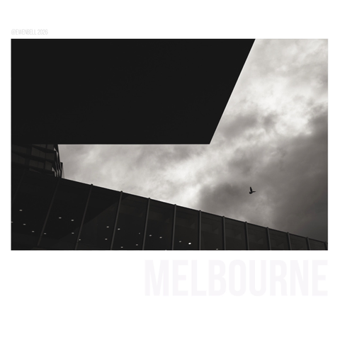 Heavy skies and a single gull looking for a place amongst the man made sky