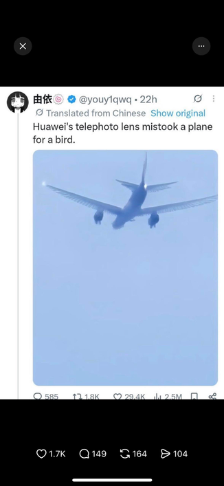 Screenshot of a social media post by a user with a handle in Chinese characters, showing an airplane with feathered wings. Text translated from Chinese reads: “Huawei's telephoto lens mistook a plane for a bird.”