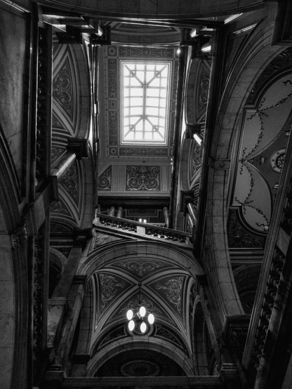 Looking up to the ornate glass ceiling inside Glasgow City Chambers on George Square, the stone and marble stairs and arches remind me of the moving stairs in the fictional Hogwarts School of Witchcraft and Wizardry.